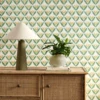 yellow botanical wallpaper and wall with cabinets and vases