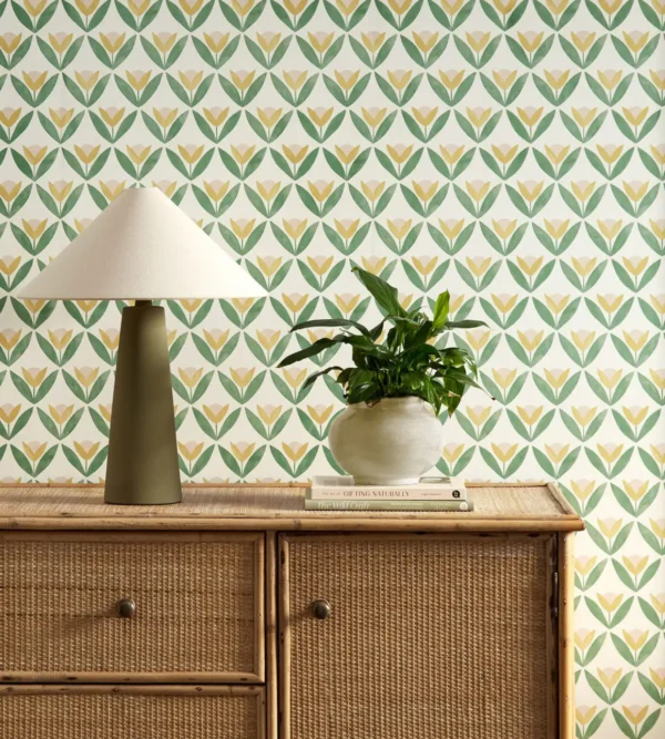 yellow botanical wallpaper and wall with cabinets and vases