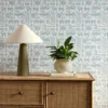 blue misc wallpaper and wall with cabinets and vases