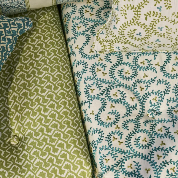 Buta Embroidery Fabric - Teal by blue botanical sofa with cushion
