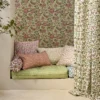 neutral botanical cushion with sofa and curtain