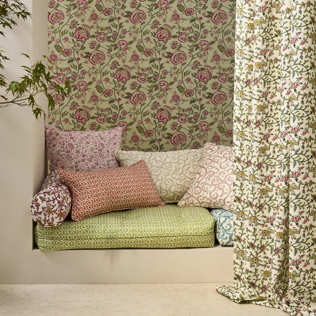 neutral botanical cushion with sofa and curtain