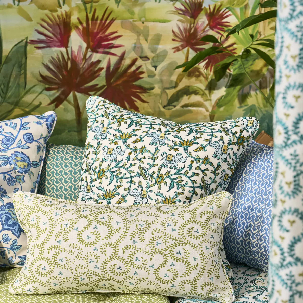 Hathi Embroidery Fabric - Teal by green botanical cushion with sofa and wall