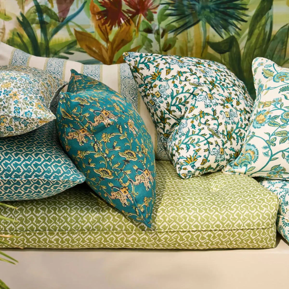 Kalpa Fabric - Teal by green botanical cushion with sofa and wall