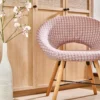 purple misc armchair with vases and cabinets