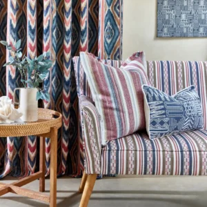 red striped sofa with cushion and curtain