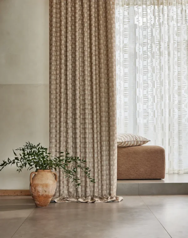 Eliana Fabric - Chalk by blue geometric curtain with sofa and vases
