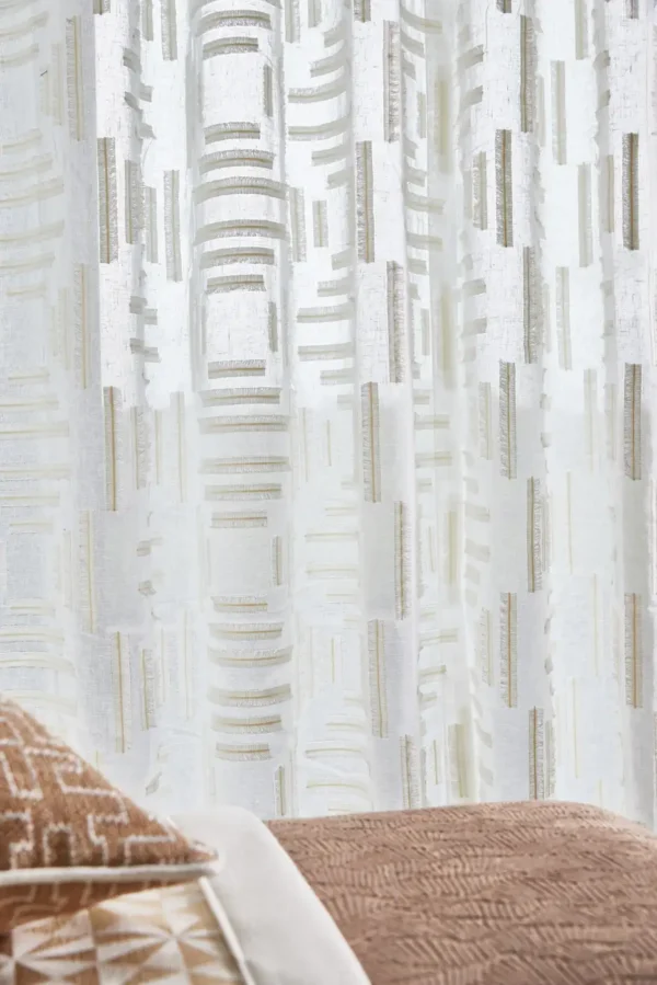 Eliana Fabric - Chalk by blue geometric curtain with cushion and sofa