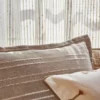 white striped curtain with sofa and armchair