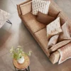 neutral striped cushion with sofa and armchair