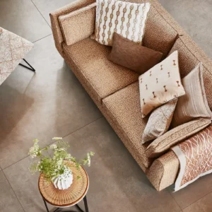 neutral striped cushion with sofa and armchair
