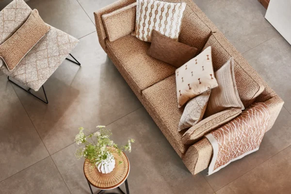River Fabric - Butterscotch by neutral striped cushion with sofa and armchair