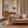 neutral misc sofa with cushion and vases
