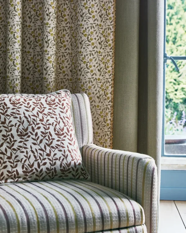 Delilah Fabric - Pumpkin by blue botanical curtain with cushion and sofa