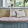 green botanical curtain with cushion and armchair