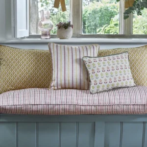 green botanical curtain with cushion and armchair