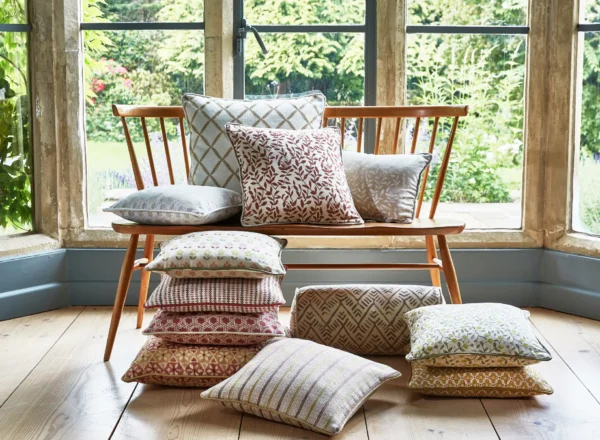 Delilah Fabric - Pumpkin by blue botanical cushion with cushion and window