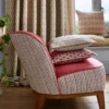 brown striped armchair with cushion and curtain