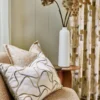 yellow misc cushion with curtain and vases