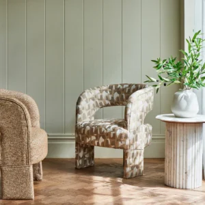 brown contemporary armchair with plants and vases