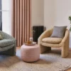neutral geometric armchair with curtain and vases