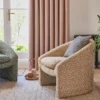 neutral geometric armchair with curtain and vases