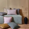 neutral geometric sofa with cushion and vases