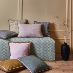 neutral geometric sofa with cushion and vases