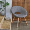 neutral geometric armchair with cushion and vases