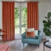 brown misc curtain with armchair and cushion
