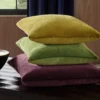 brown plain cushion with curtain and vases