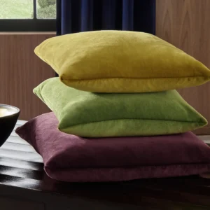 brown plain cushion with curtain and vases