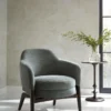 black-grey plain armchair with vases and window