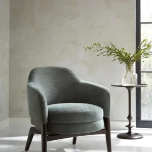 black-grey plain armchair with vases and window