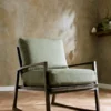 red plain armchair with wall and vases