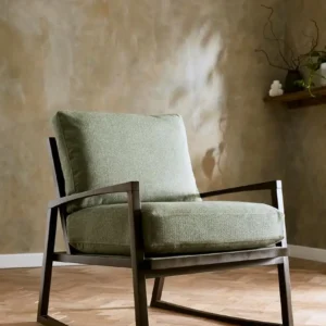 red plain armchair with wall and vases