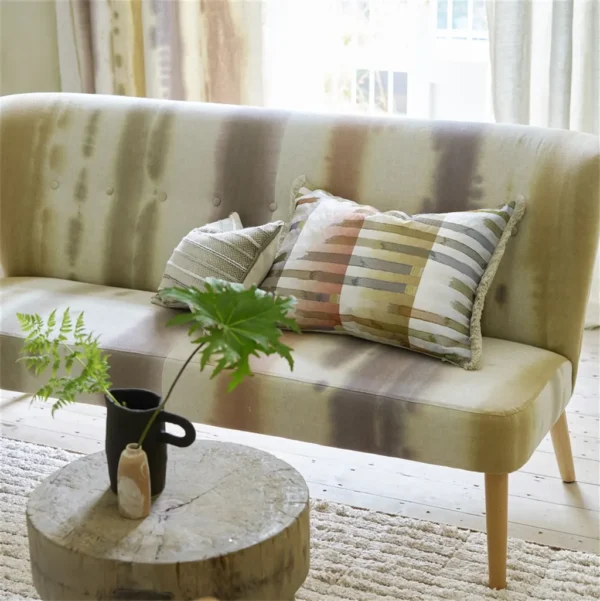 Brera Arte Fabric - Linen by brown striped sofa with cushion and vases