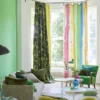 multicolour striped curtain with sofa and armchair