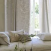 neutral misc sofa with curtain and vases