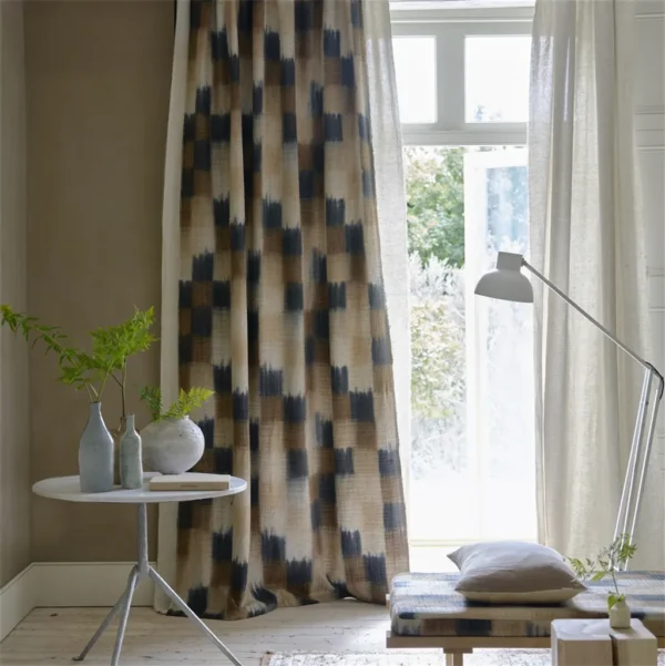 brown checked curtain with cushion and side table