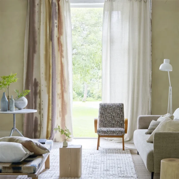 brown geometric curtain with armchair and sofa
