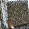 brown geometric armchair with curtain