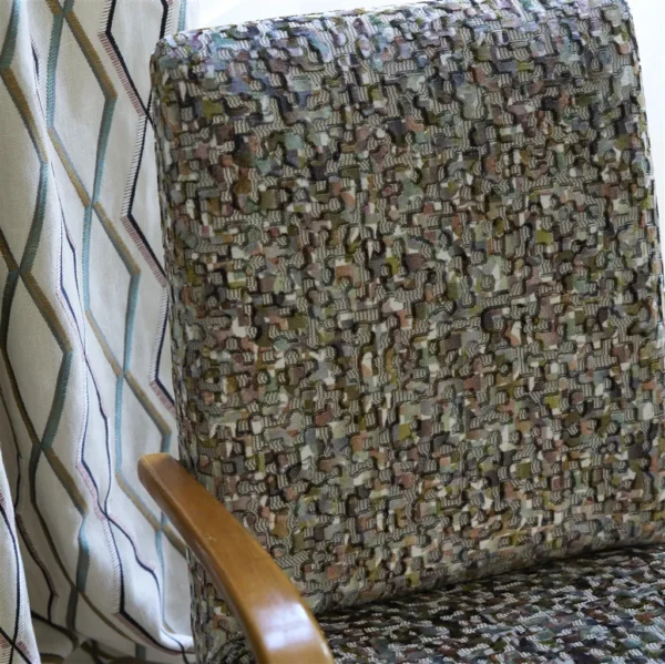 brown geometric armchair with curtain