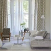 multicolour striped curtain with sofa and armchair