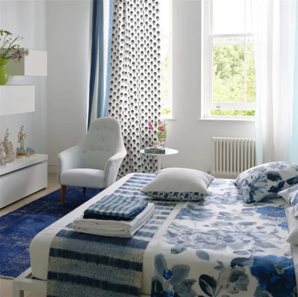 Teasel Fabric - Indigo by blue spotted curtain with bed and armchair