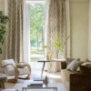 yellow geometric curtain with armchair and sofa