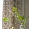 yellow geometric curtain with vases