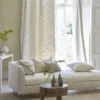 pink misc curtain with sofa and coffee table