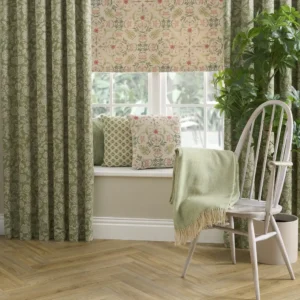 green botanical curtain with cushion and chair