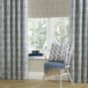 blue striped cushion with chair and fabric